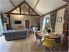 Stunning Modern open plan kitchen/living/dining with vaulted ceiling, exposed beams, original brick & flint walls, woodburner.