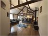 Stunning open plan lounge/kitchen/diner with a central woodburner.  Vaulted ceilings, original beams.  Windows looking out onto the private courtyard garden. 50inch wall mounted smart t.v.